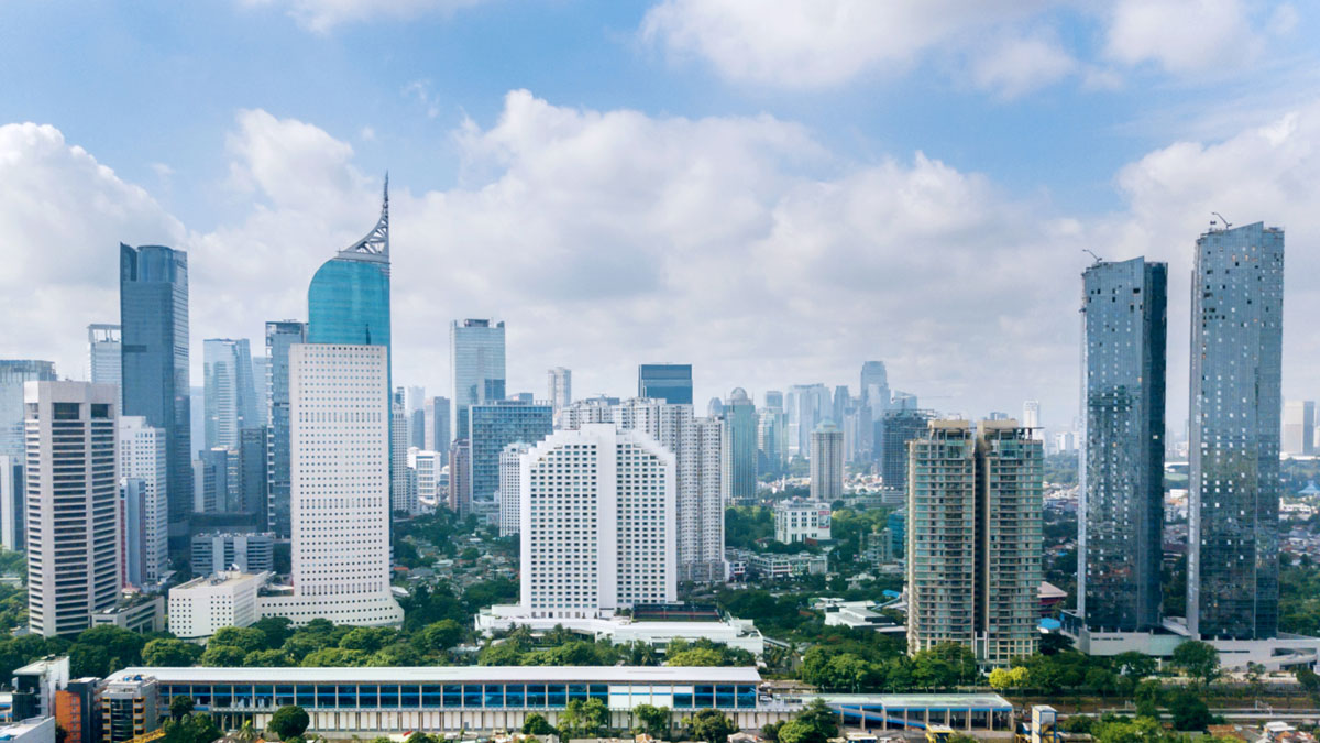 Panoramic view of Jakarta cityscape with residential houses, modern office and apartment buildings