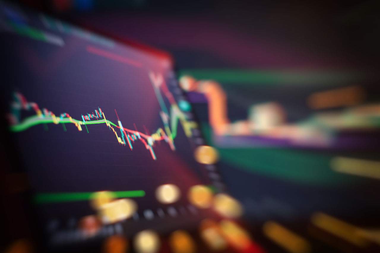 Abstract financial trading interface with dynamic stock market candlestick chart